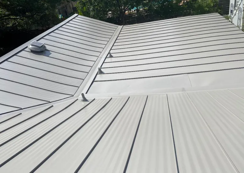 Solar attic fan installed on a metal roof for Roof Ventilation in Montvale